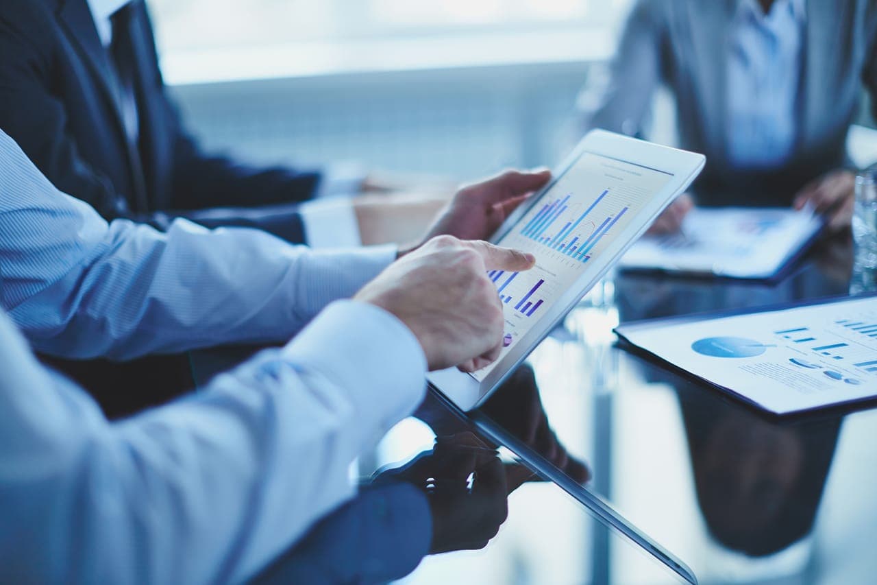 Reviewing investment analytics on a tablet